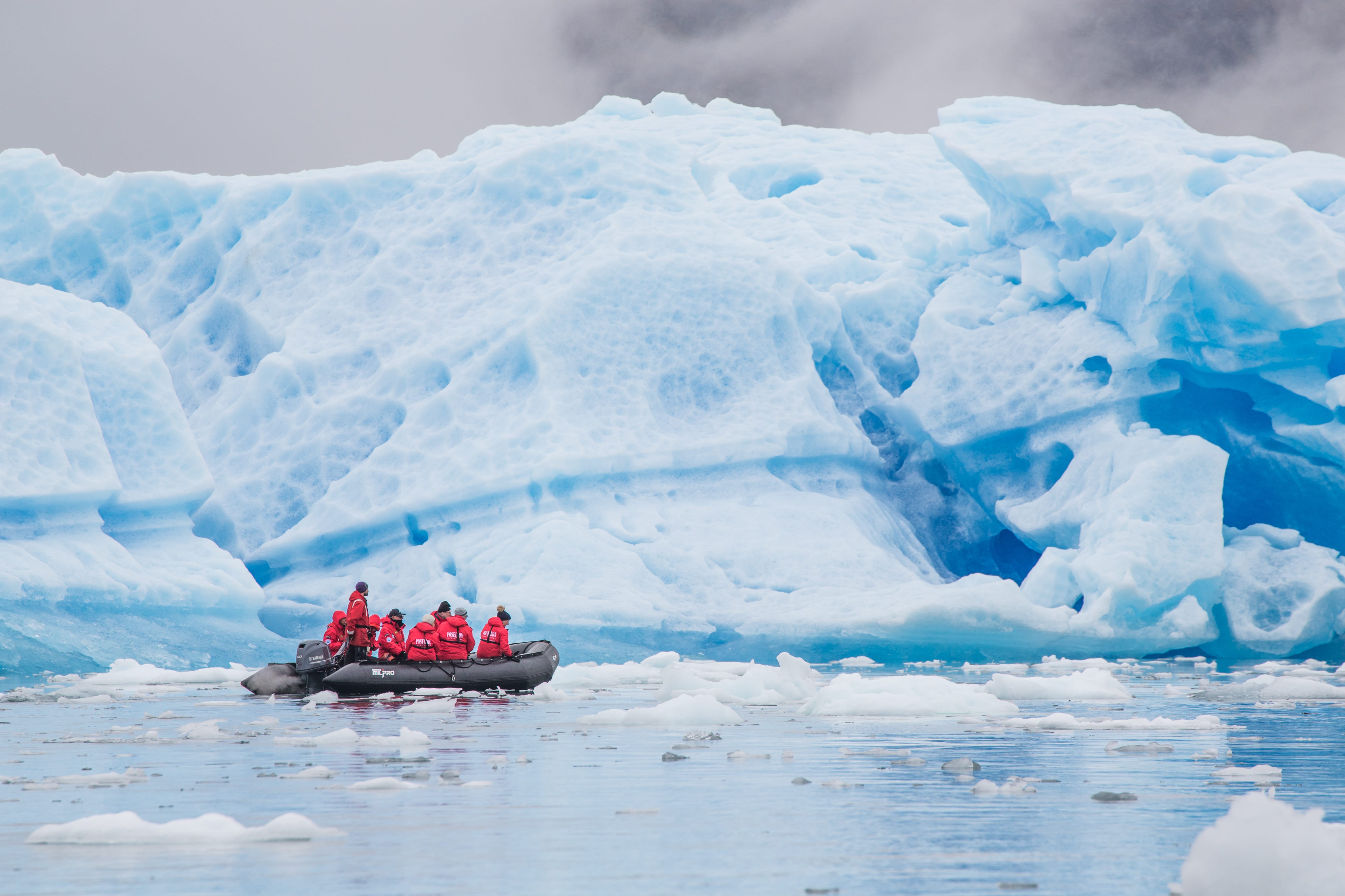 Expedition cruising among icebergs by Zodiac