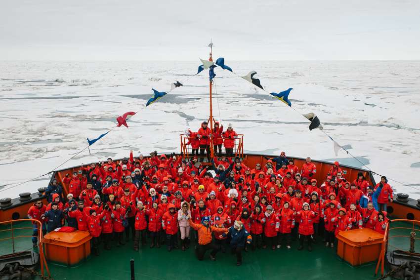 North Pole passengers on the bow of nuclear-powered icebreaker
