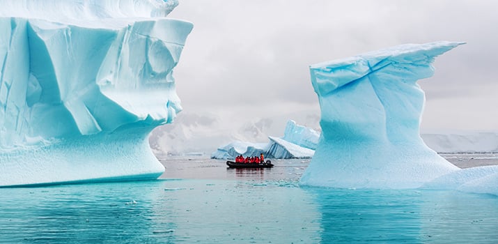 Zodiac cruising among icebergs in Greenland