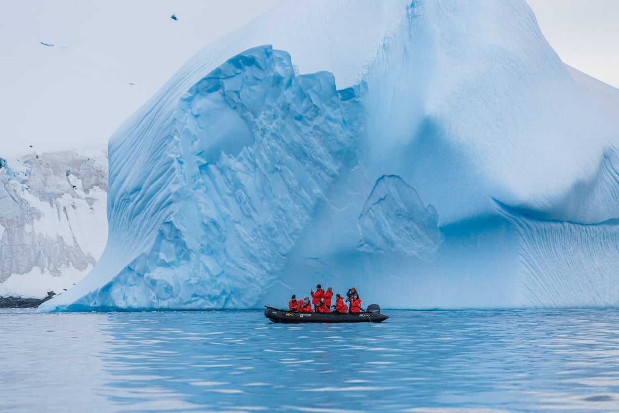 boat-beside-iceberg.jpg
