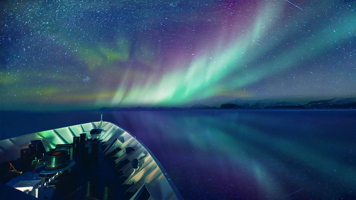 Northern lights from the bow of the expedition ship